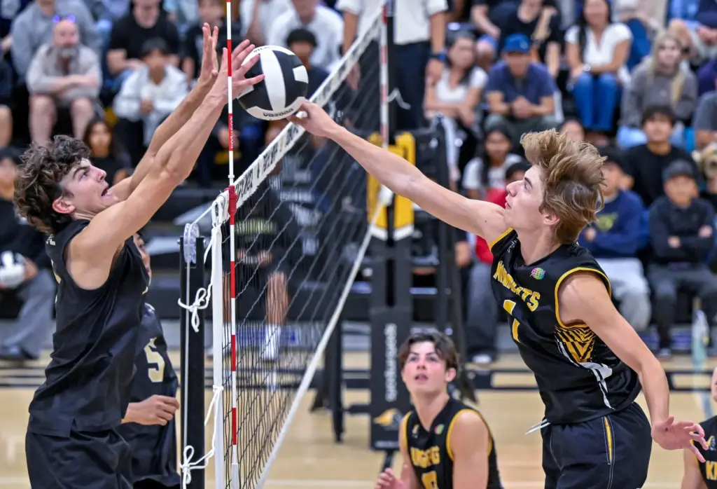 Servite opposite hitter Camden Bohn, left, and Foothill outside hitter...
