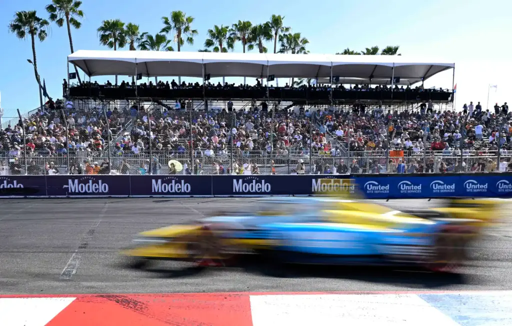 Race fans pack the turn grandstand as Indycar driver Christian...