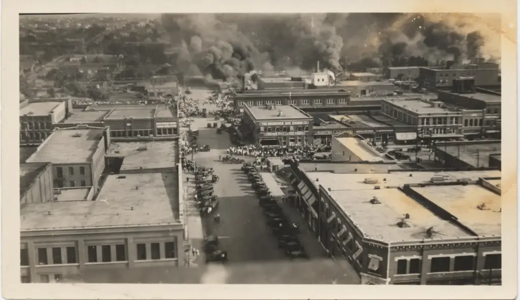 a crowd gathering to watch the fire