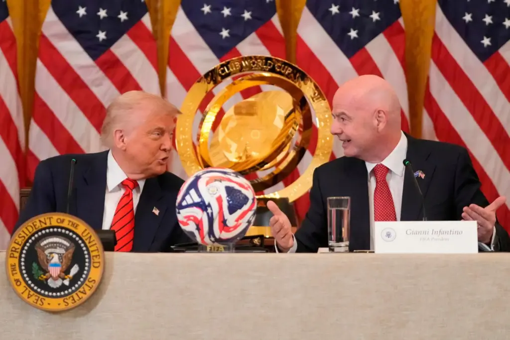 FILE – President Donald Trump and FIFA President Gianni Infantino...