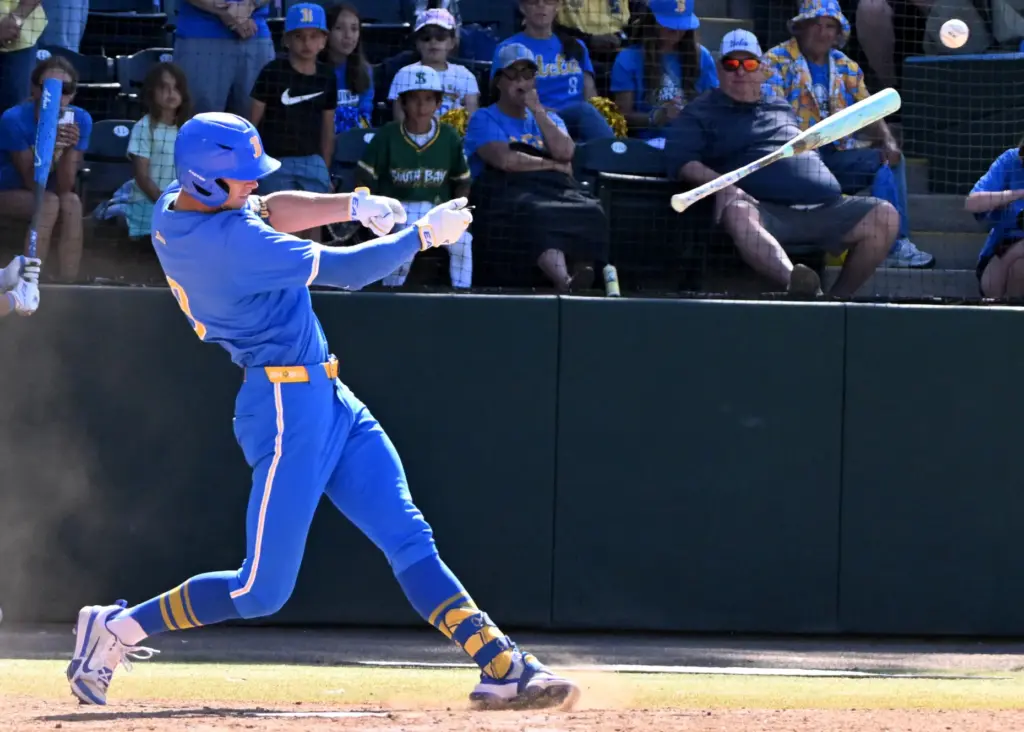 Will Gasparino #9 of the UCLA Bruins singles as he...