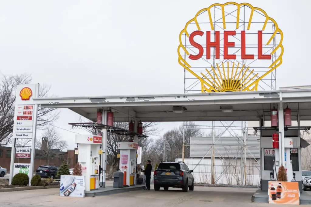 A man pumps gas Sunday, March 15, 2026, in Cambridge,...