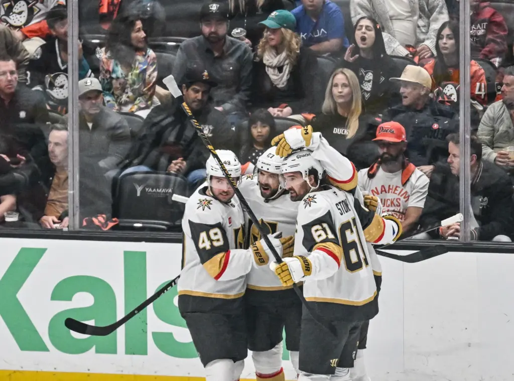 Vegas Golden Knights players Ivan Barbashev, left, Shea Theodore, center,...