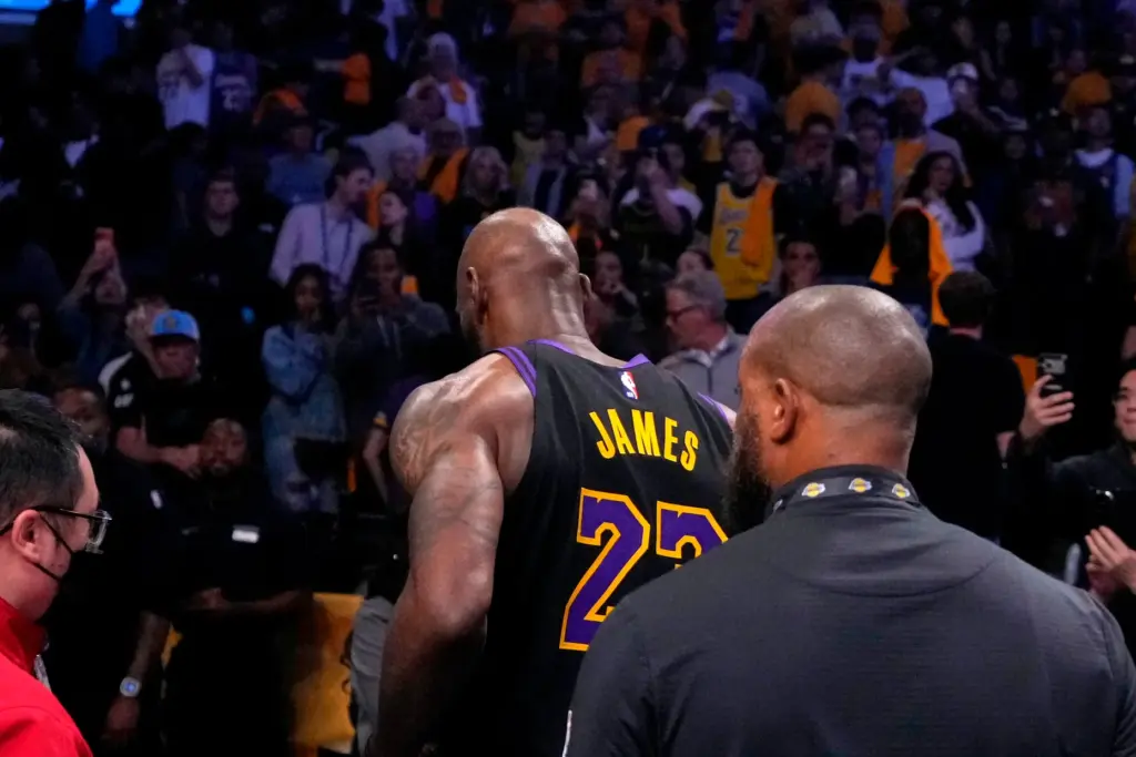 Lakers forward LeBron James walks off the court after their...