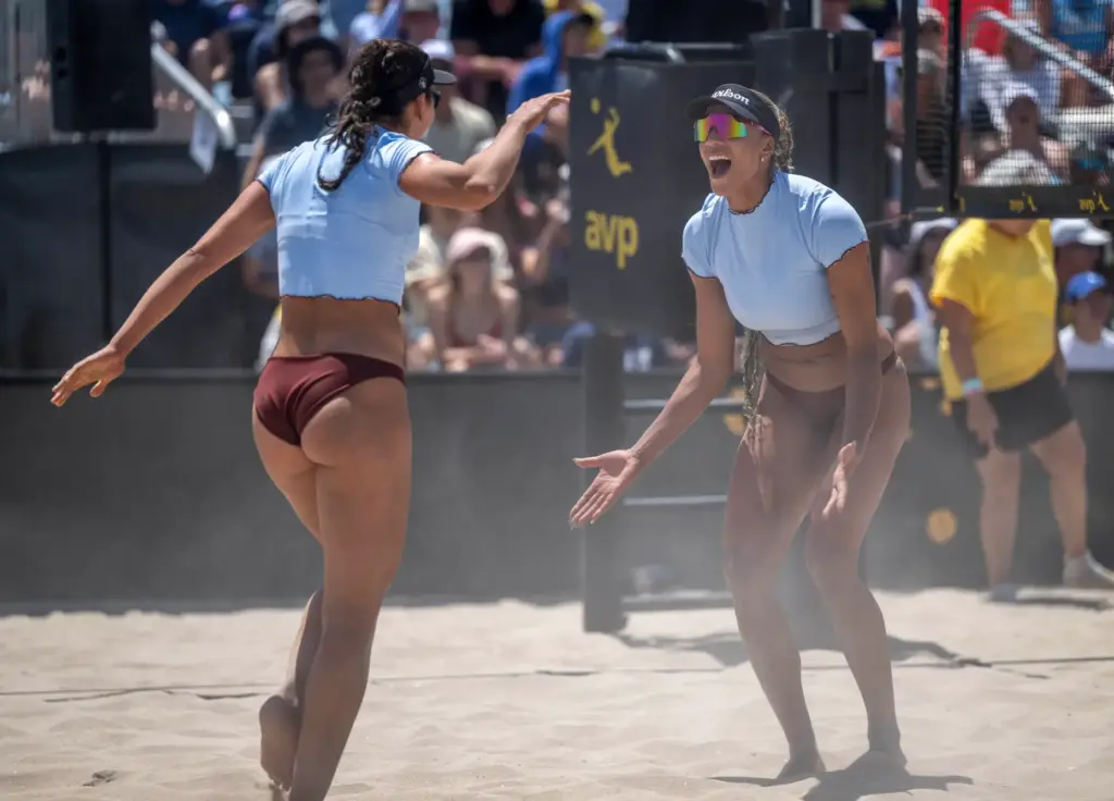 Teammates Melissa Humana-Peredes, left, and Brandie Wilkerson celebrate a set...