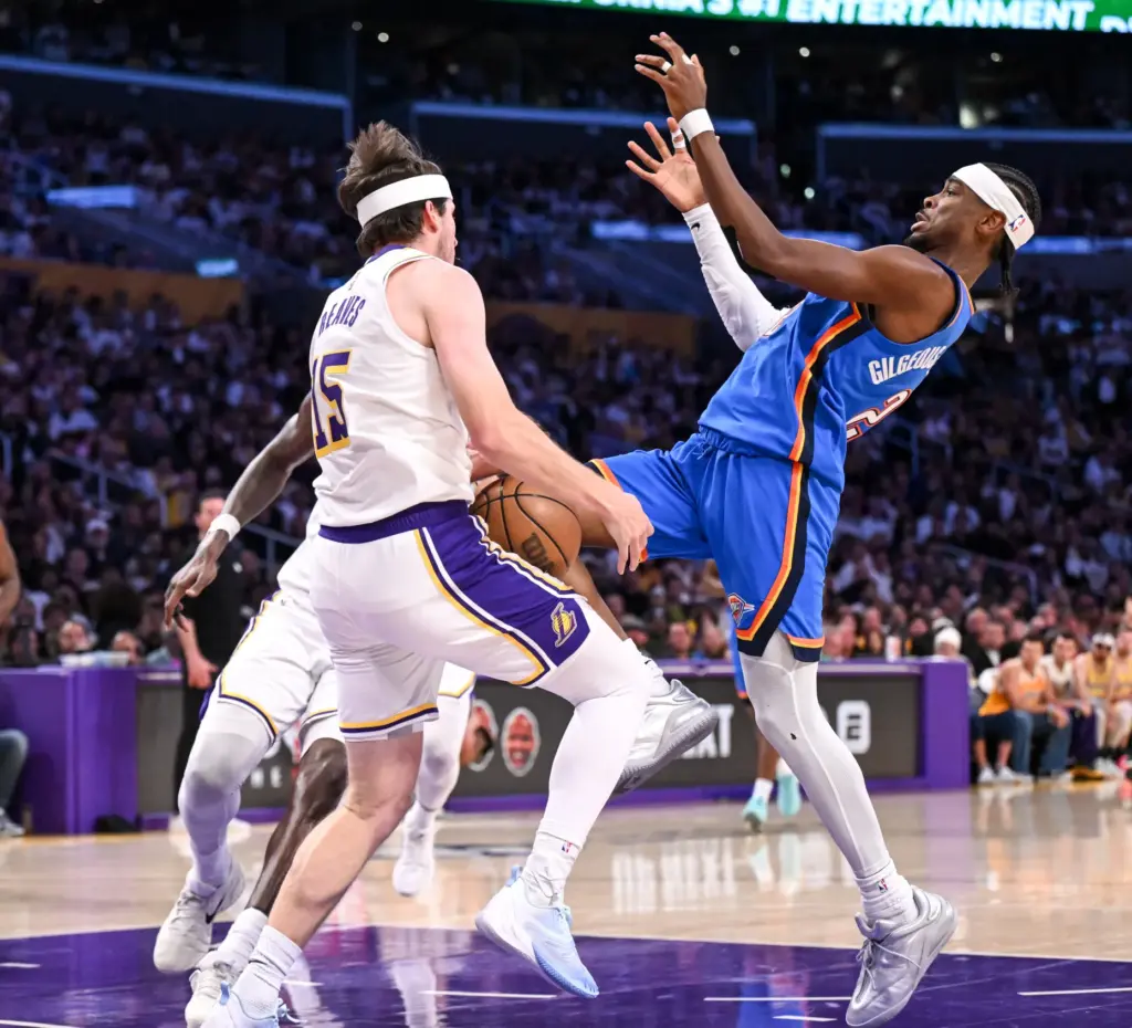 Oklahoma City Thunder star Shai Gilgeous-Alexander, right, loses the ball...