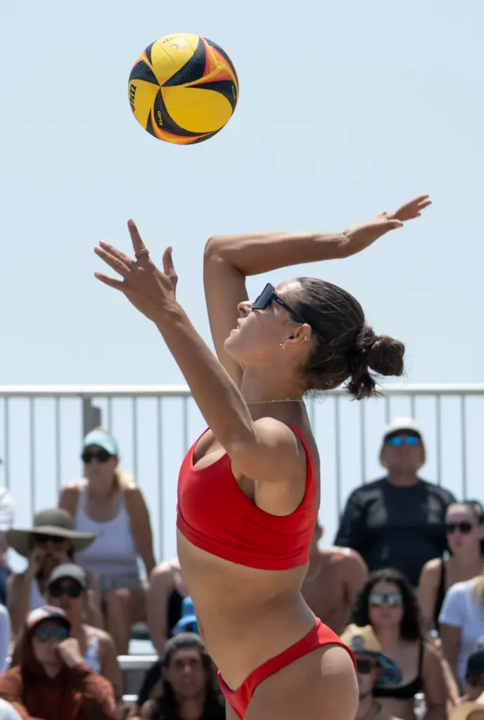 Devon Newberry serves the ball during the AVP womenâs finals...