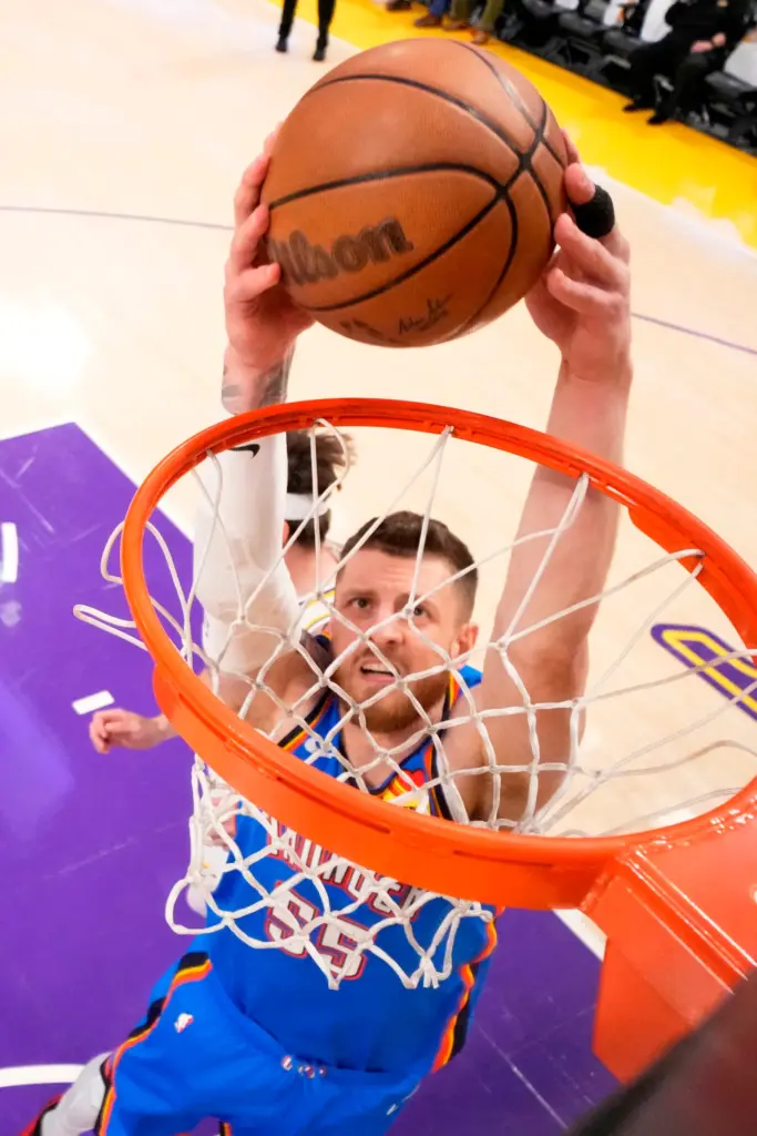 Oklahoma City Thunder center Isaiah Hartenstein dunks during the first...