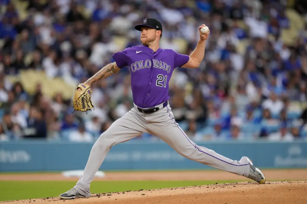 Colorado Rockies starting pitcher Kyle Freeland throws to the plate...