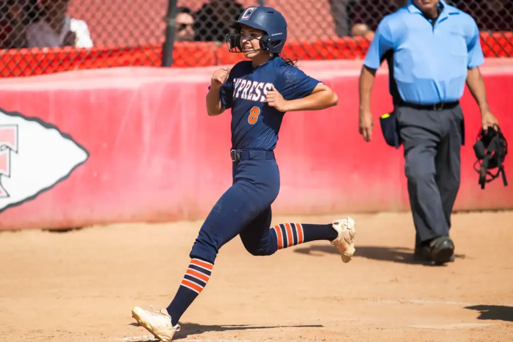 Cypress’ Morgan Anderson scores a run in the fourth inning...