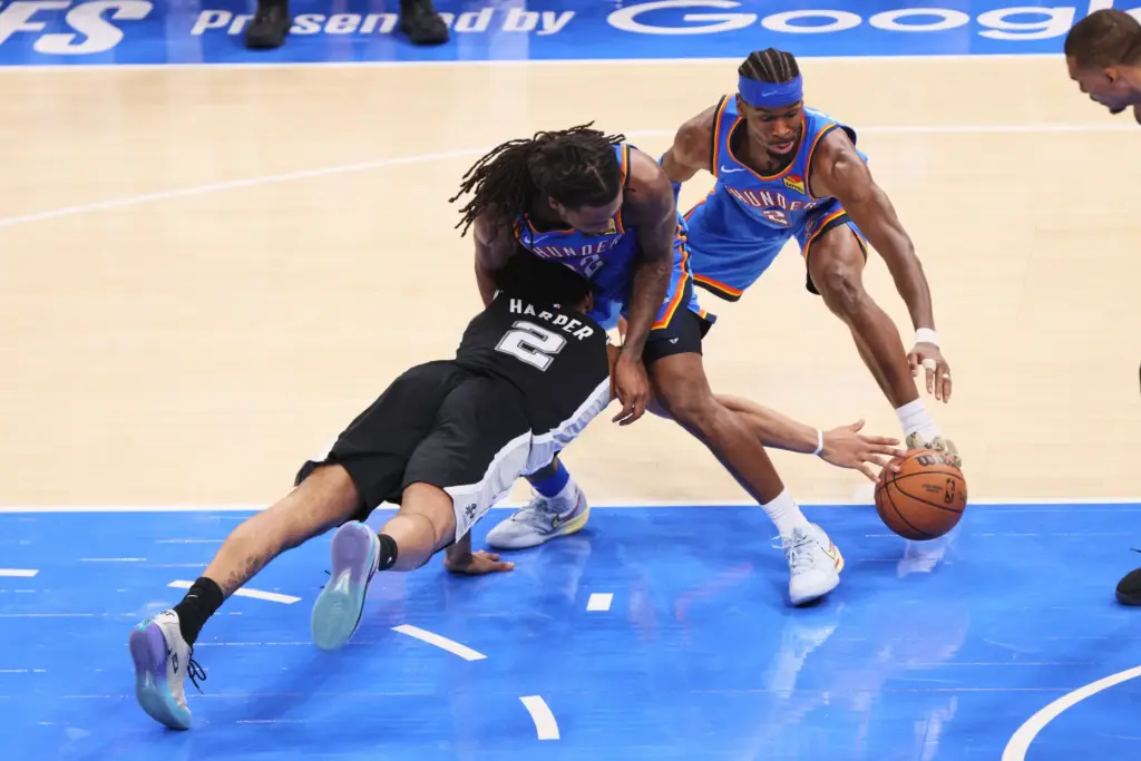 San Antonio Spurs guard Dylan Harper (2) battles for a...