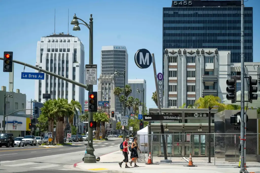 People walk past the Metro D Line Subway Extensionâs Wilshire/La...