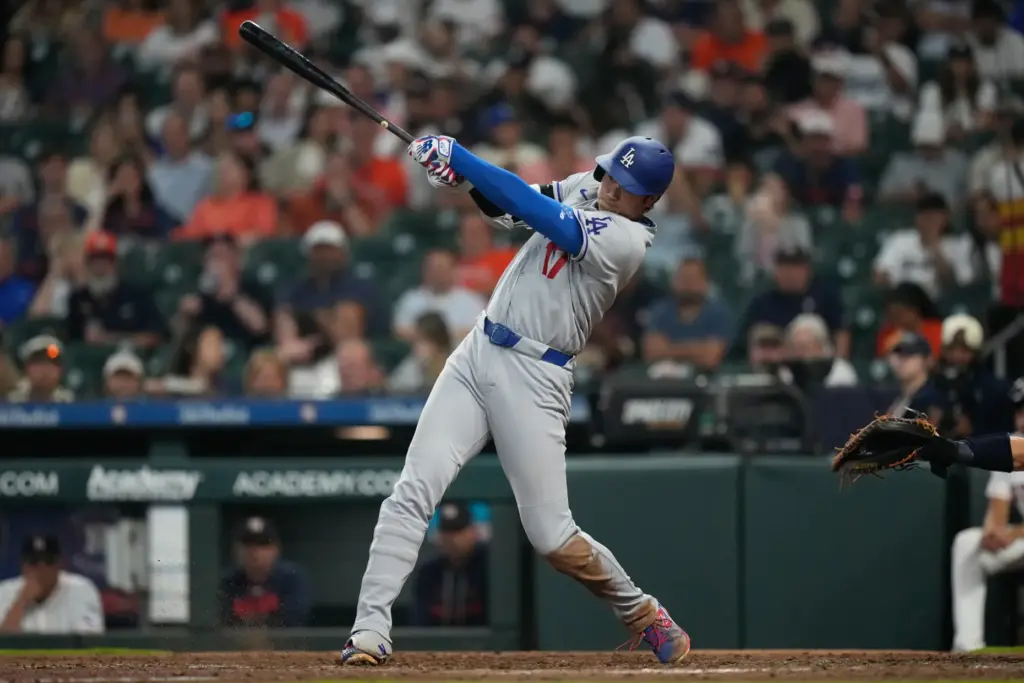 Dodgers star Shohei Ohtani hits a single during the seventh...