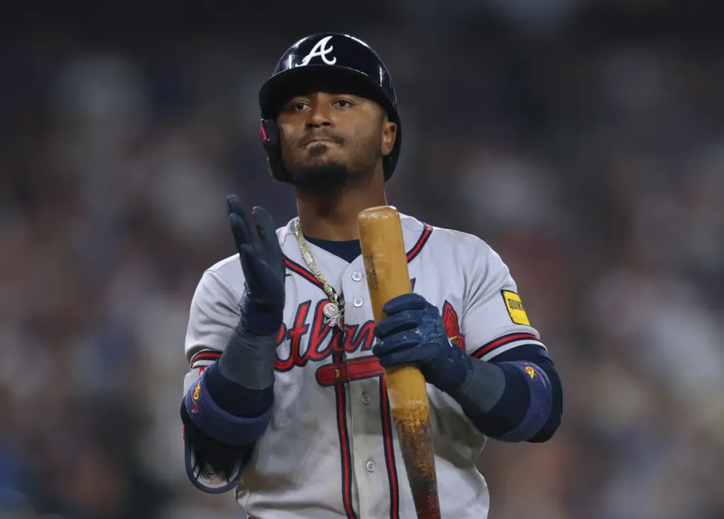 The Atlanta Braves’ Ozzie Albies shows his frustration after striking...