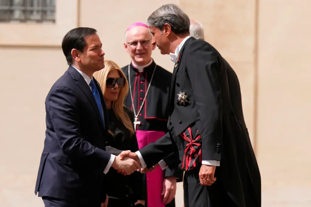 Secretary of State Marco Rubio is greeted by Archbishop Petar RajiÄ.