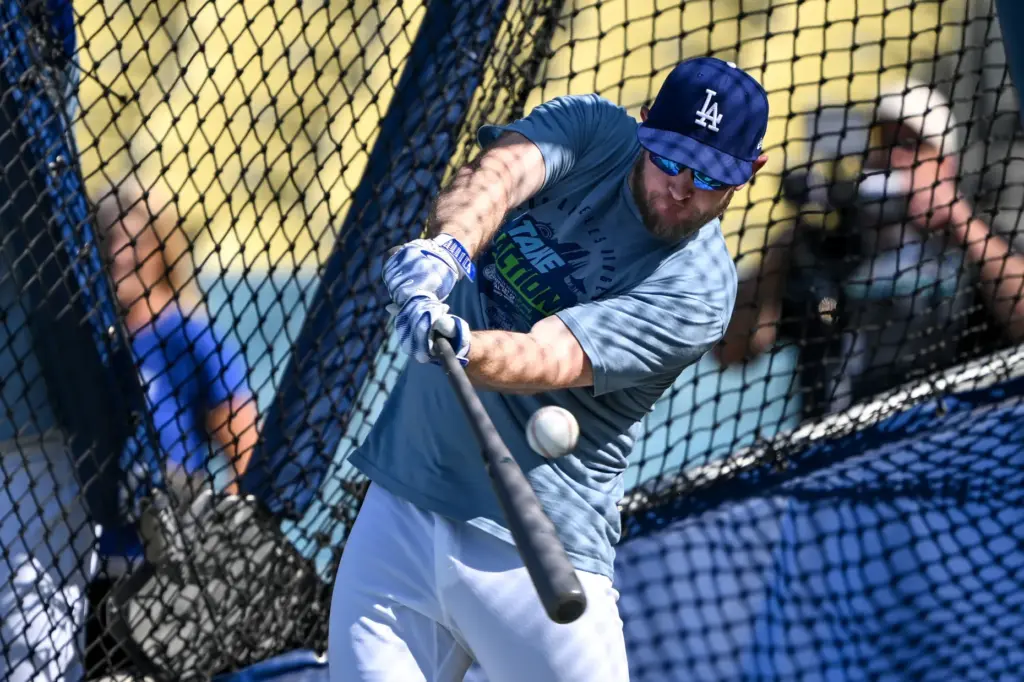 The Dodgers’ Max Muncy takes batting practice before a game...