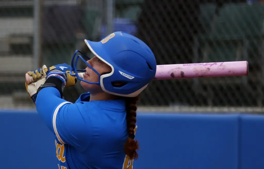 UCLAâs Megan Grant watches the ball leave the yard for...