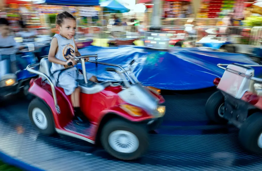 Ezra Evans, 3, from Chino enjoys a ride on opening...