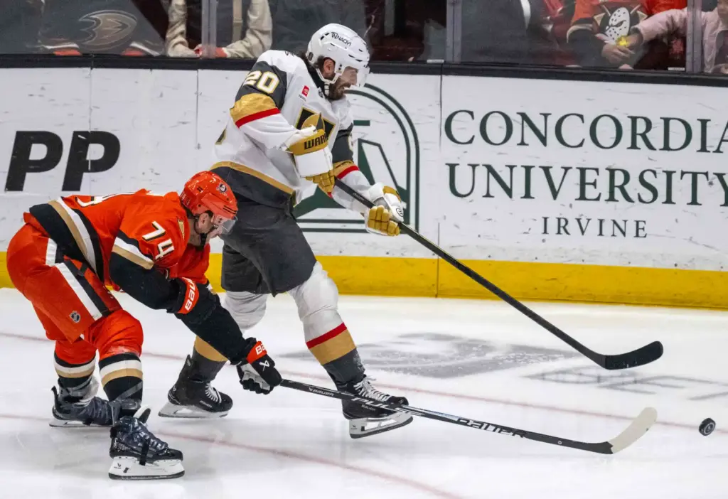The Vegas Golden Knightsâ Brandon Saad, right, shoots the puck...