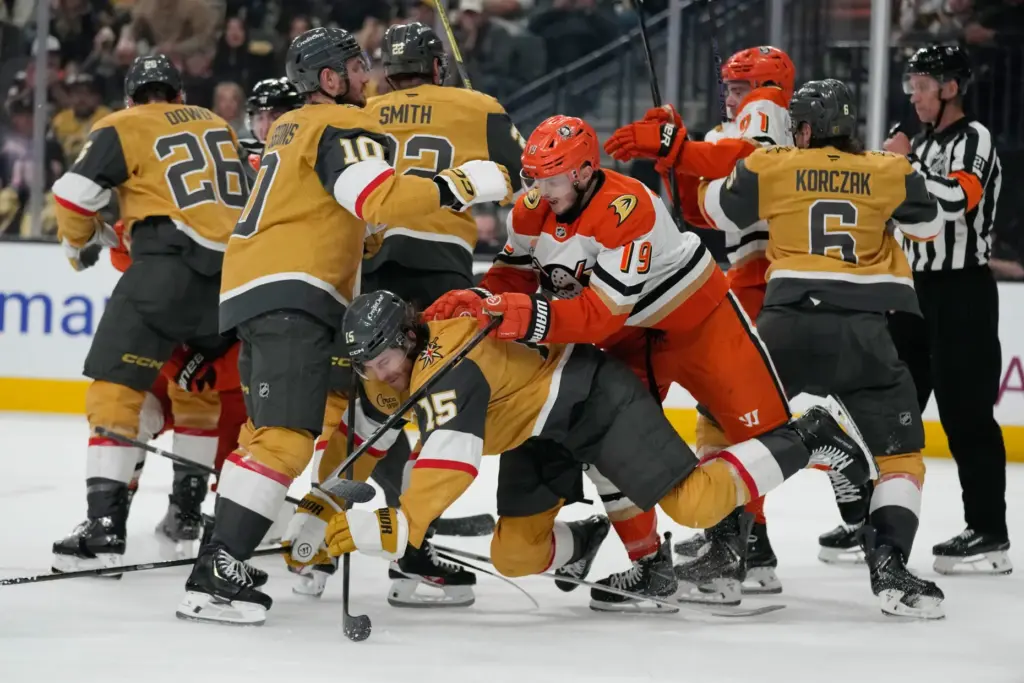Ducks right wing Troy Terry (19) knocks down Vegas Golden...