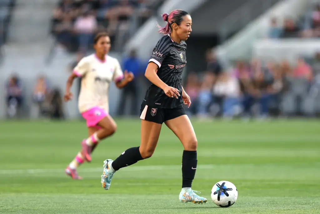 Angel City FC forward Jun Endo moves the ball against...