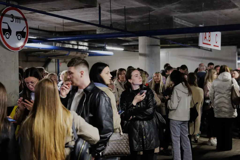 People take shelter in an underground car park