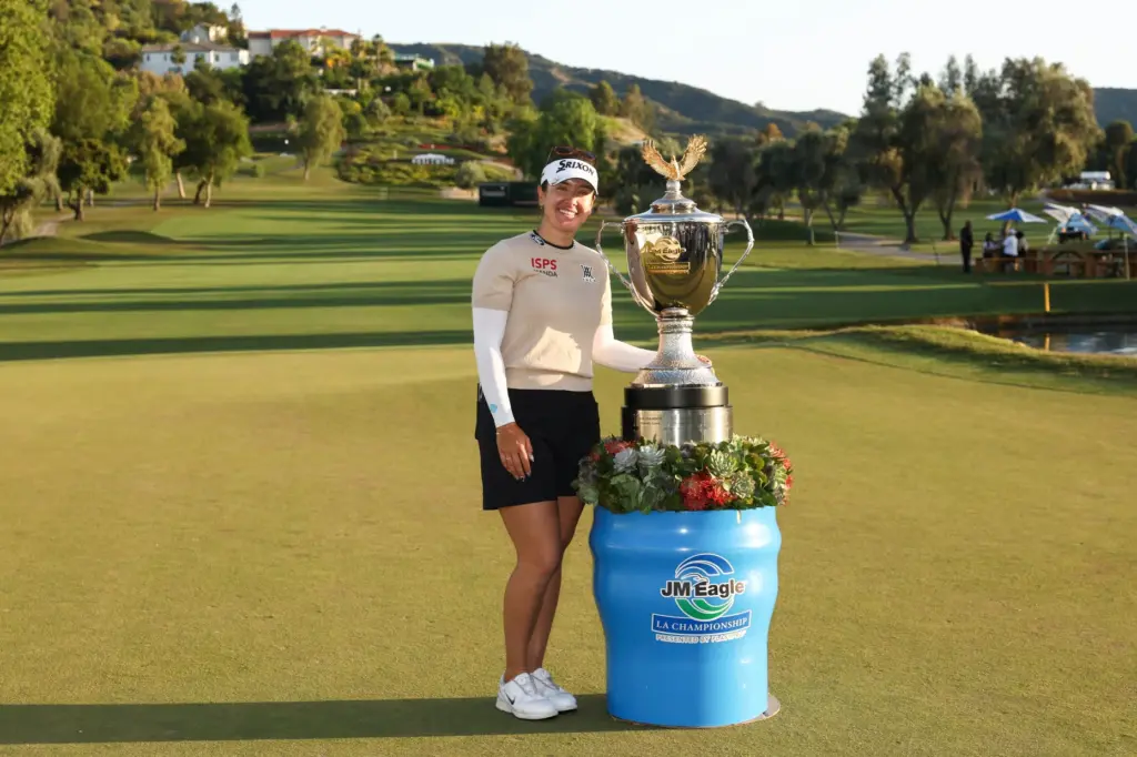 Hannah Green poses with the trophy after winning the LPGA...