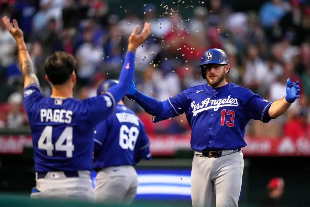 The Dodgers’ Max Muncy, right, has sunflower seeds thrown at...