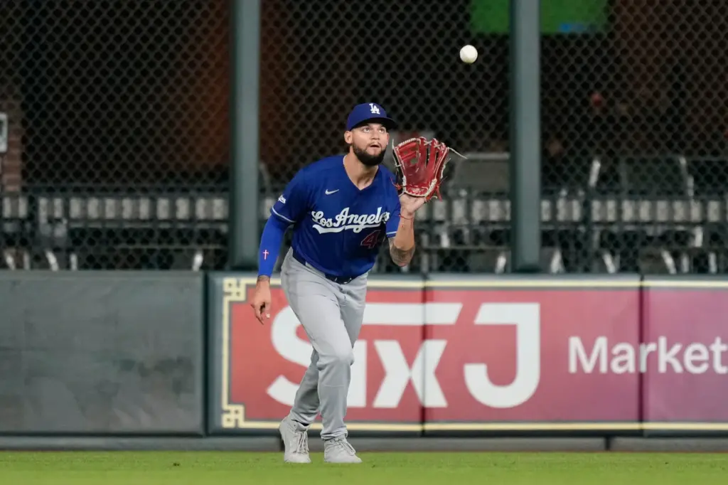 Dodgers center fielder Andy Pages catches a fly ball hit...