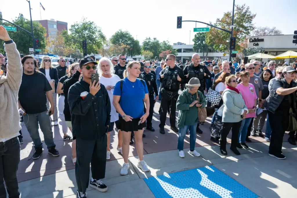People line the street during a memorial ceremony for Burbank...