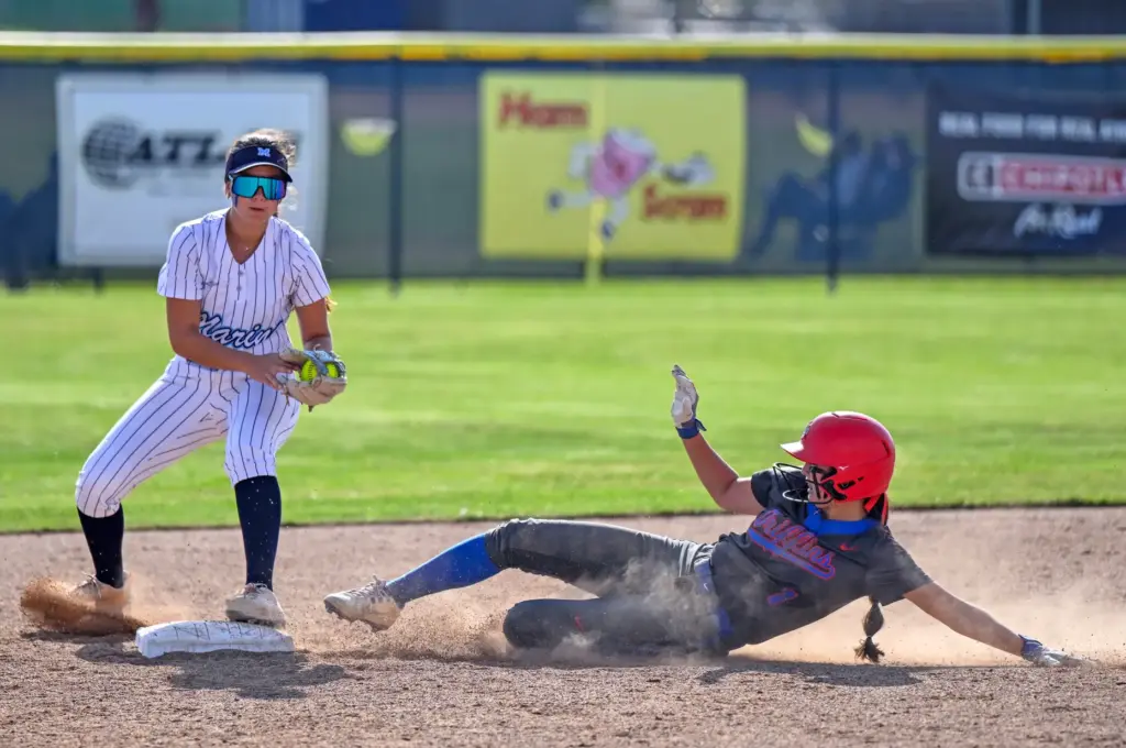 Marina second baseman Olivia Archer tags out Los Alamitos shortstop...