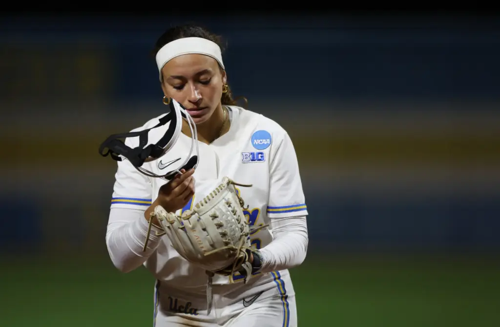 UCLA starting pitcher Taylor Tinsley walks off the field after...
