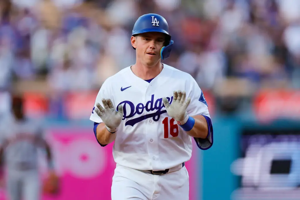 Dodgers designated hitter Will Smith gestures to his teammates in...