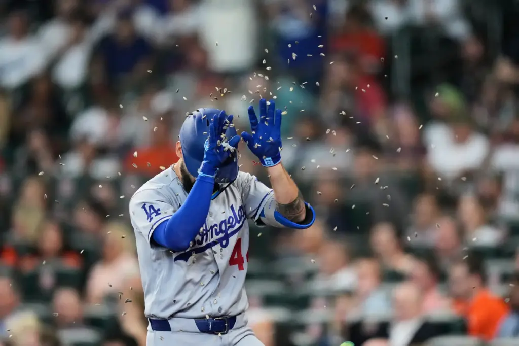 The Dodgers’ Andy Pages gets showered with sunflower seeds as...