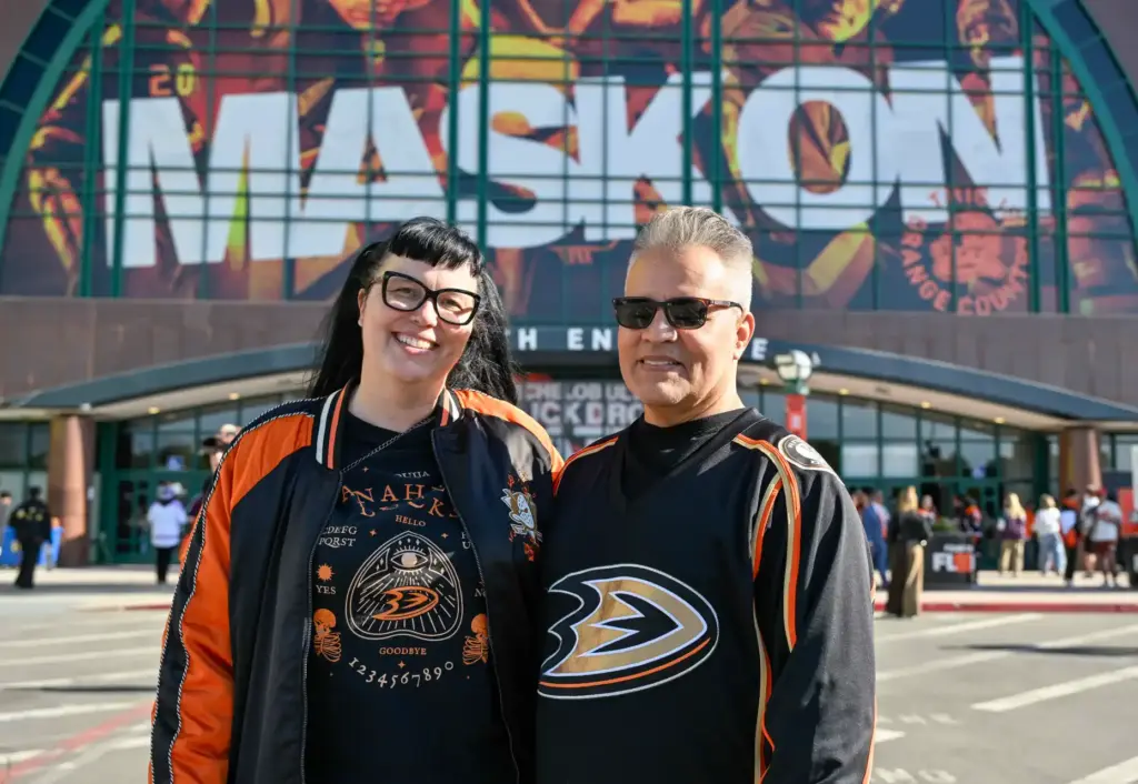 Longtime Ducks fans Irene and Ross Amador of Irvine stand...