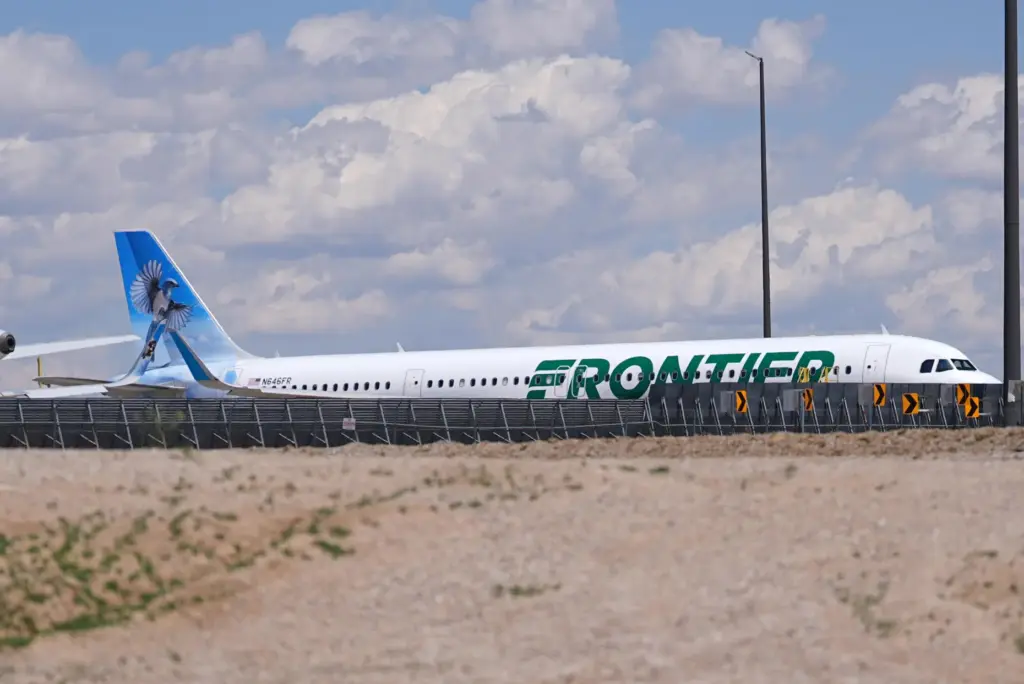 Frontier Airlines jetliner number n646fr sits outside the airlines technical...