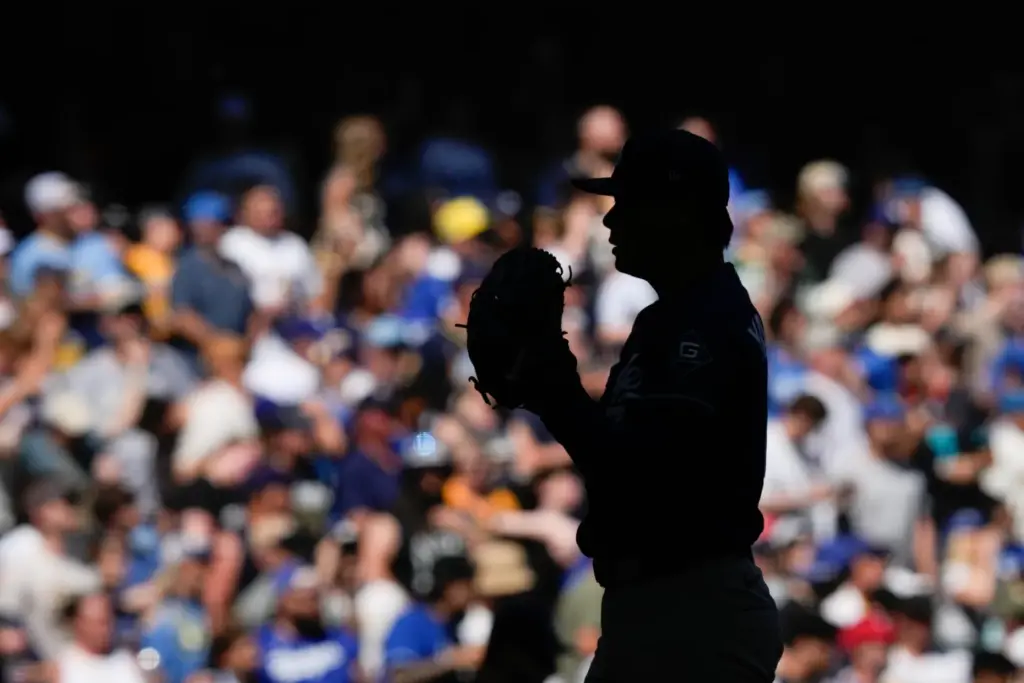 Dodgers pitcher Yoshinobu Yamamoto prepares to throw during the seventh...