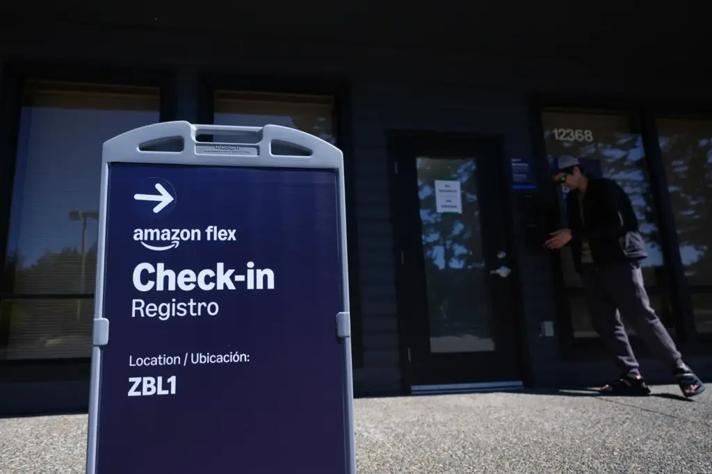 A driver checks in before picking up an order at an Amazon Now location.