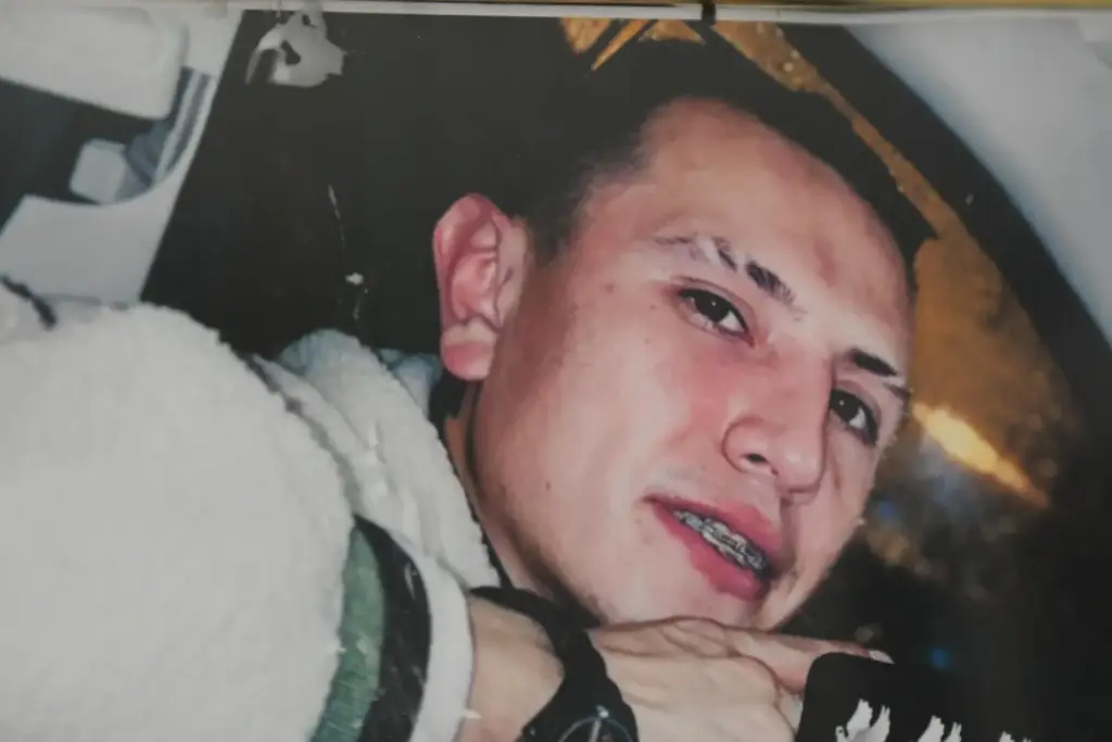 A photo of Brayan Rayo Garzon is displayed in his mother's apartment.