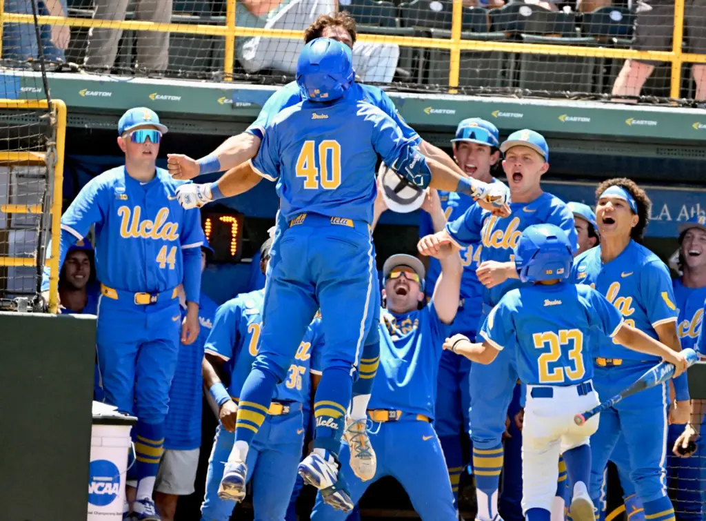 Cashel Dugger #40 of the UCLA Bruins celebrates with teammates...