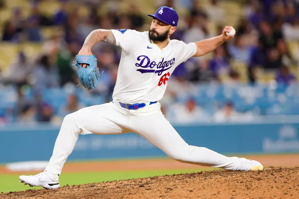 Dodgers relief pitcher Tanner Scott throws to the plate during...