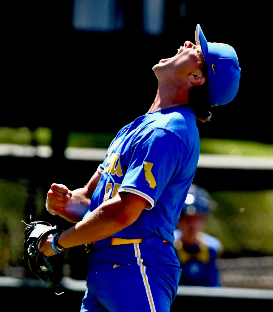 Relief pitcher Cal Randall #85 of the UCLA Bruins reacts...