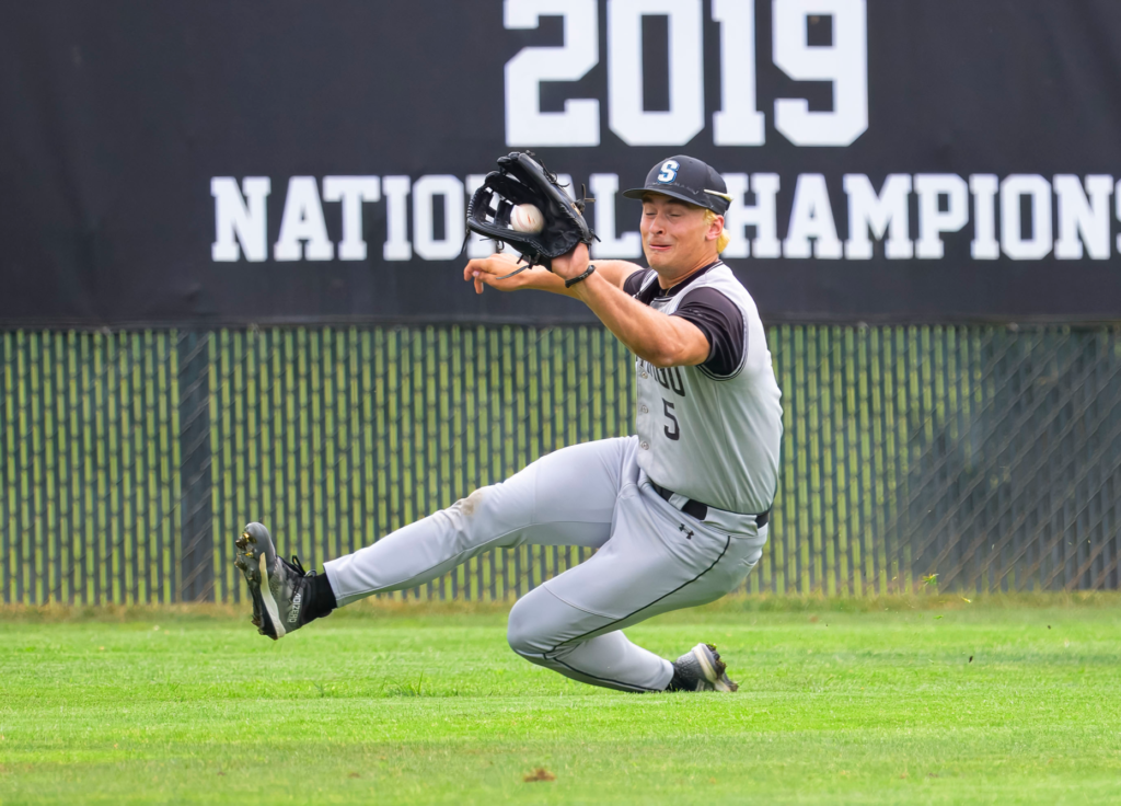 Santiago outfielder Max Eldridge gets the put out on a...