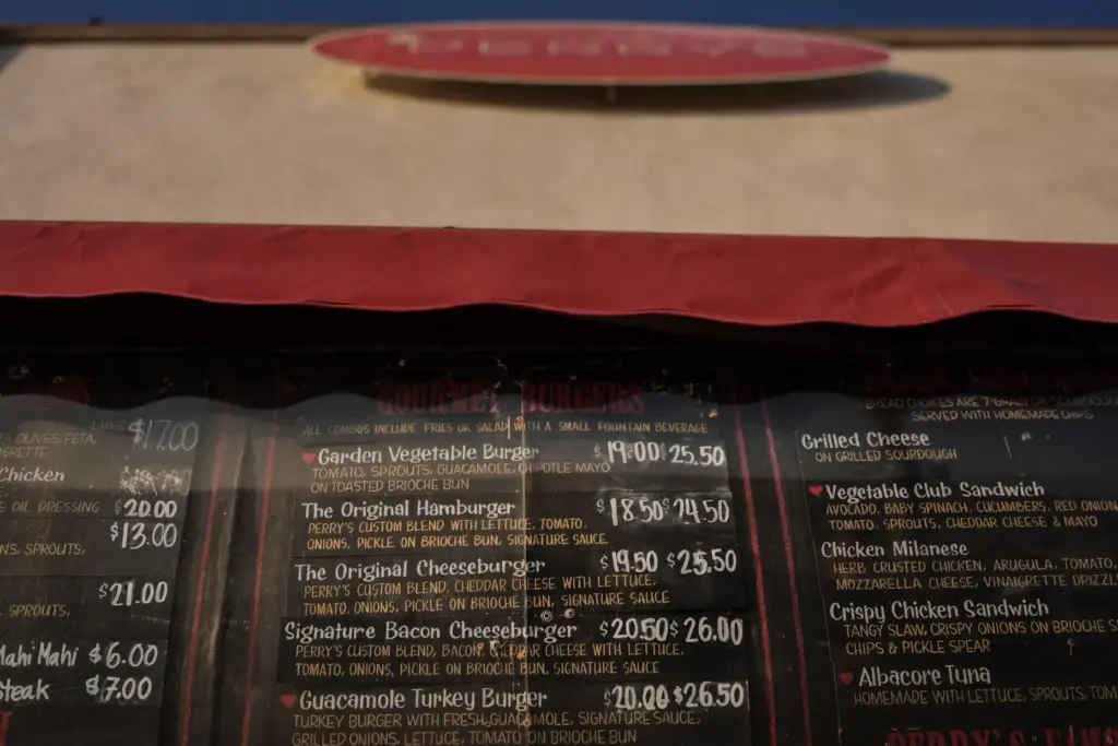 Menu prices are displayed at a cafe in Santa Monica,...