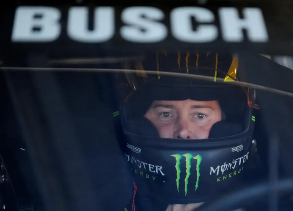 Kyle Busch waits in his car before practice.