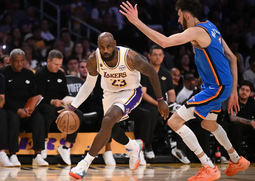 Lakers star LeBron James drives up the court as Oklahoma...
