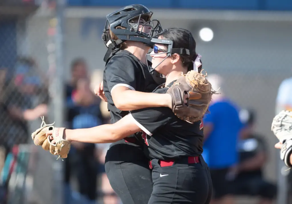 JSerraâs, Annabel Raftery, (#44), (L), Liliana Escobar, (#3), (R), celebrate...