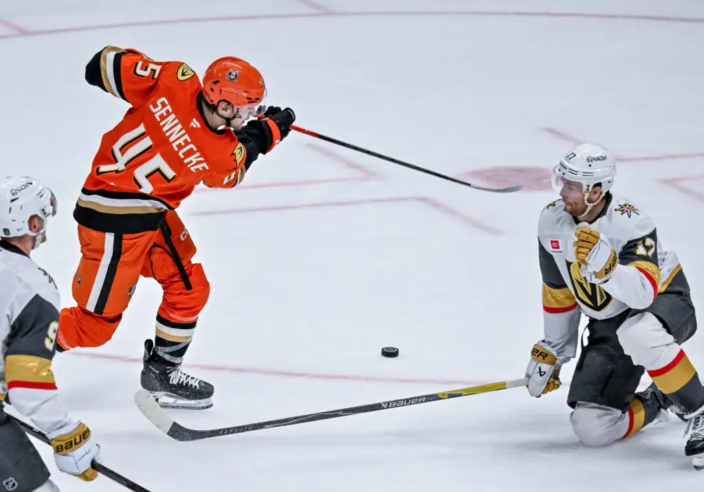 The Ducksâ Beckett Sennecke, left, takes a shot on goal,...