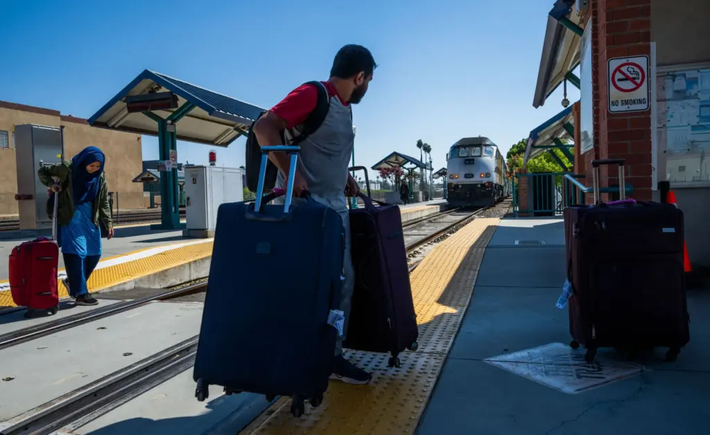 Passengers arrive on Metrolink train 899 into the Riverside-Downtown Station...