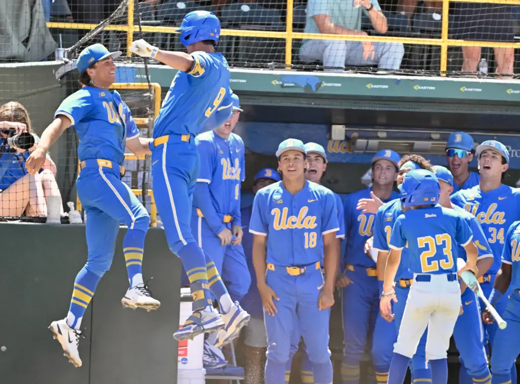 Will Gasparino #9 of the UCLA Bruins celebrates with teammates...